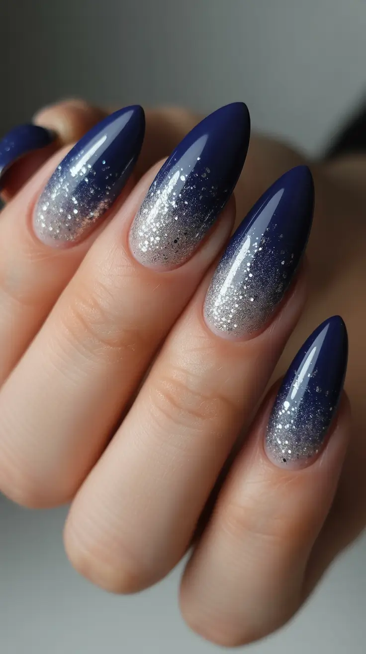 almond winter 2025 / 2026 nails design and color - Midnight-to-Moonlight Blue Glitter Fade
