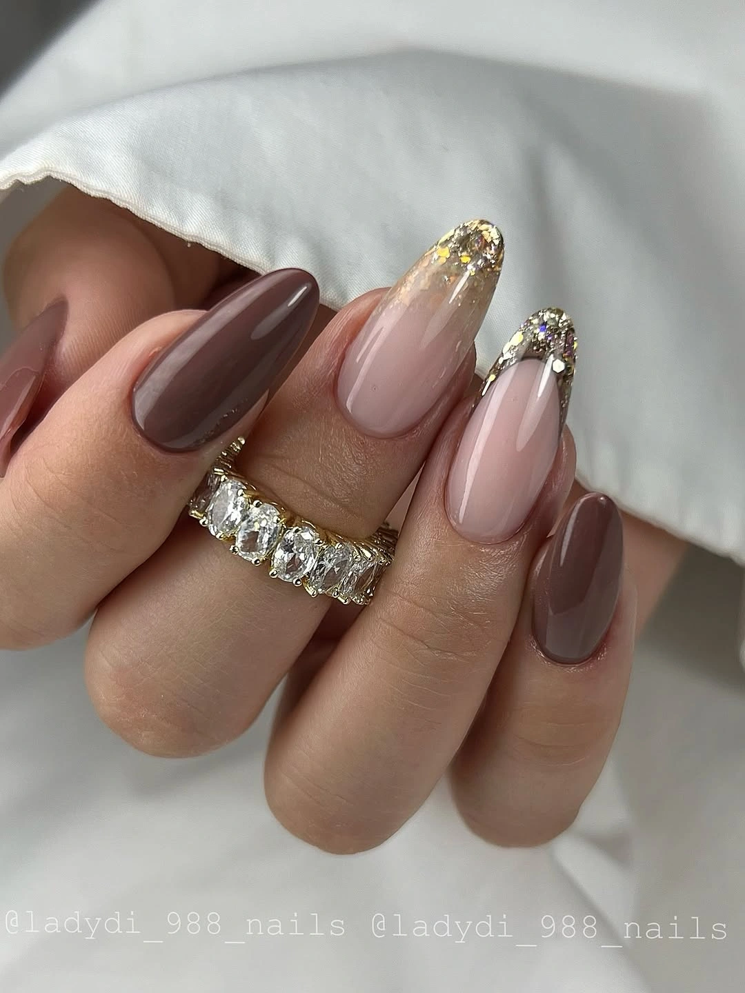 Almond taupe and blush nails with chunky metallic sparkling tips