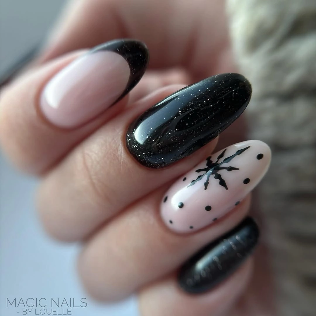 Almond nails with black sparkle, French tip, snowflake, and pale pink